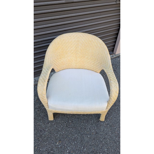 Coastal style cream colored woven leather armchair made by Preview Furniture (High Point). Chair is structurally sound and...