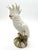 Striking vintage Ethan Allen Italian porcelain cockatoo sculpture, featuring a beautifully modeled white cockatoo perched...