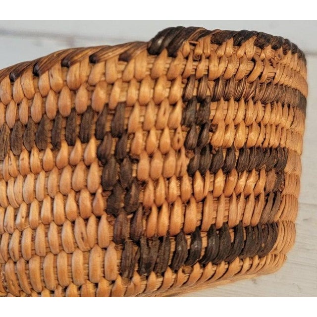 Hand woven basket in very small scale. The condition is pristine.