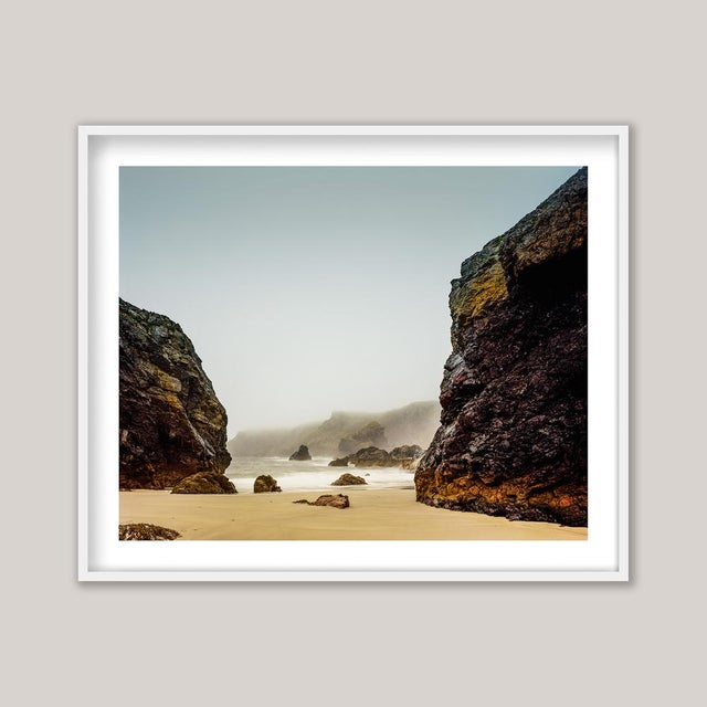 A midsummer photograph of Kynance Cove, a breathtaking beach on Cornwall’s Lizard Peninsula. A veil of soft, misty rain...