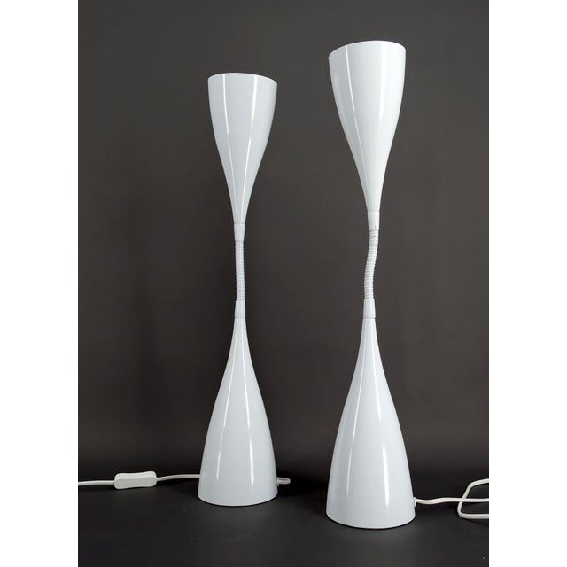 Add a touch of timeless elegance to your home with this stunning pair of vintage lamps in white enamelled sheet metal,...