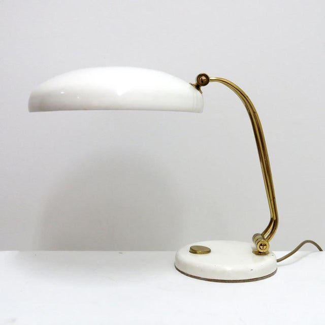 Wonderful table lamp by Hillebrand, 1960, in white and brass, on/off switch at the base, shade and arm are adjustable,...