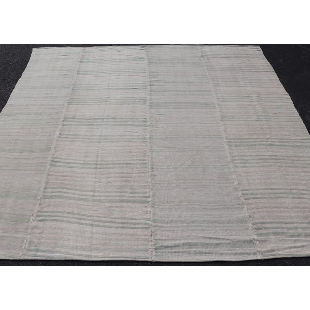 Measures: 9'2 x 10'2 Vintage Turkish Kilim Rug in Soft Sage, Pale Taupe, and Faded Sand Stripes. Keivan Woven Arts /...