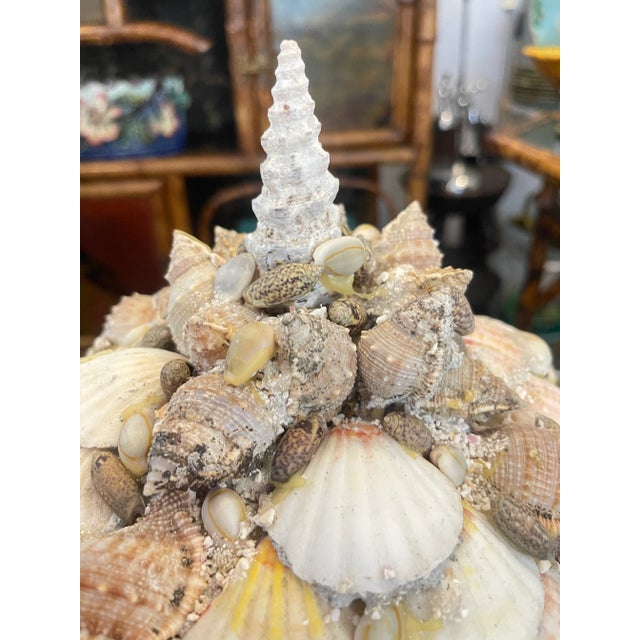 Just arrive from the estate of Suzy Hilfiger, this Vintage Incrusted Seashell Dome Coffee Table Lidded Box. This box is...
