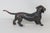 This beautiful Dachshund figurine is made of metal. This highly charming figurine is marked "Buxtehude" on the left...