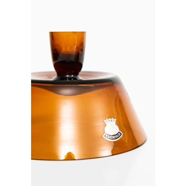 A pair of candlesticks / vases designed by Bengt Edenfalk. Produced by Skruf in Sweden. This piece is attributed to the...