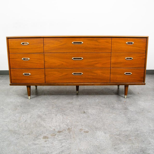 Outstanding BP John 9 drawer dresser / credenza in walnut. Very nice construction, great details. Comes with 9 drawers...