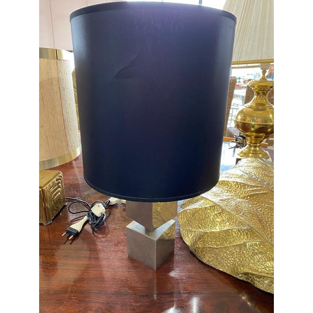 Italian Table Lamp in squere silver post and blue lamp shade. This iconic lamp combines elegant geometric shapes with a...