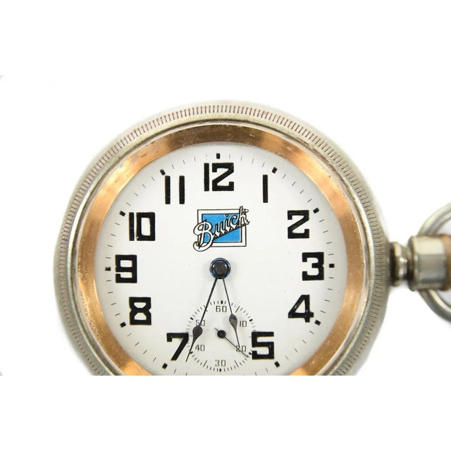Dueber antique pocket watch with Buick automobile advertising logo. Rare. size 3 x 3" Buick logo, white dial with Arabic...