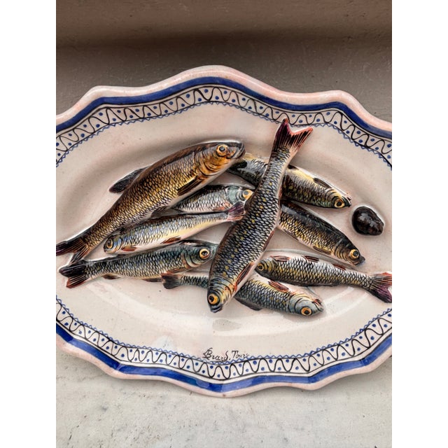 19th Century Trompe l'oeil platter of Leon Brard with sardines on a rustic blue and white platter in the Rouen style. In...