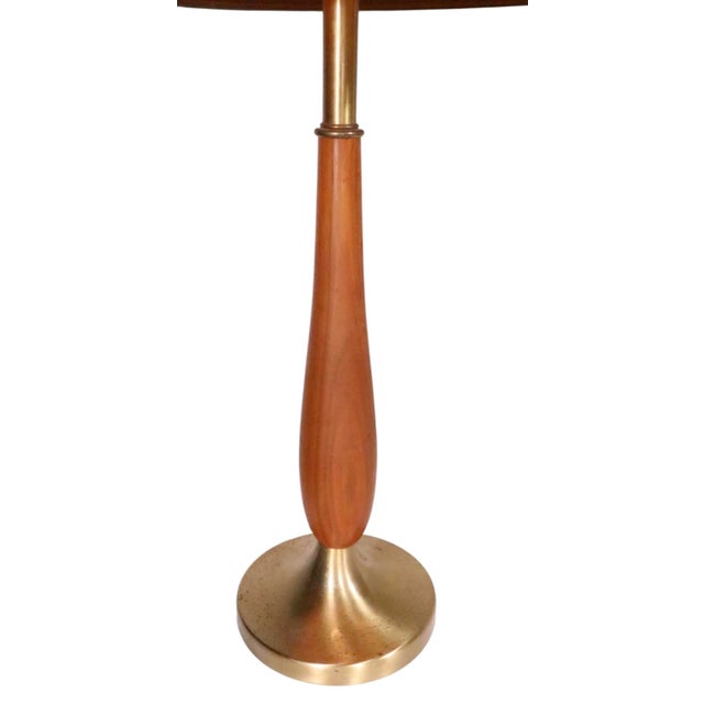 Classic pair of Mid Century table lamps, with original burlap shades. The lamps feature spun metal brass finish bases,...