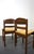 Pair of Brutalist-style chairs in solid wood with rush seats. Original design on the backrests, very stable. Well...