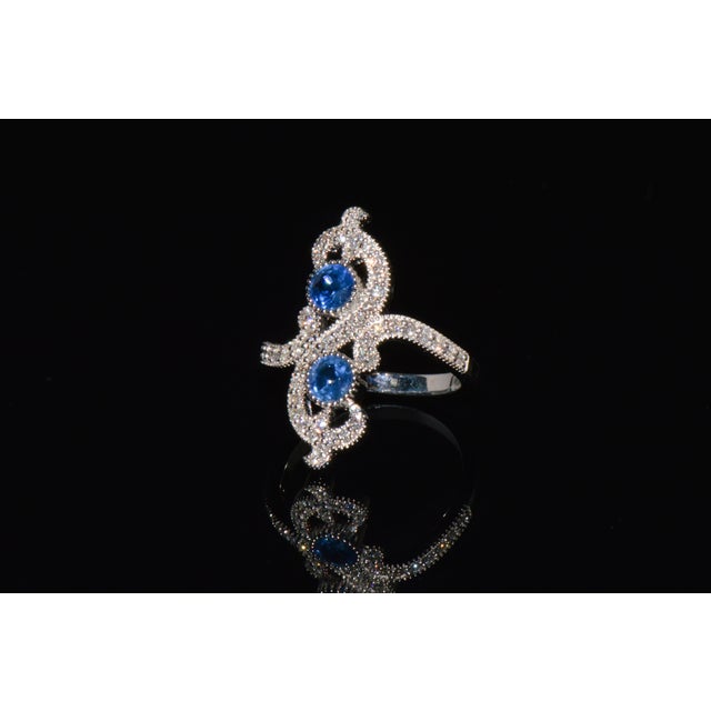 Top quality certified 18K solid white gold 1.40CTS diamond and sapphire filigree cocktail ring. This elegant ring features...