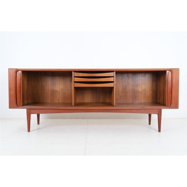 1960s-1970s, Bernhard Pedersen, Denmark. Very high-quality workmanship. Teak (veneer and solid parts). with roller shutter...