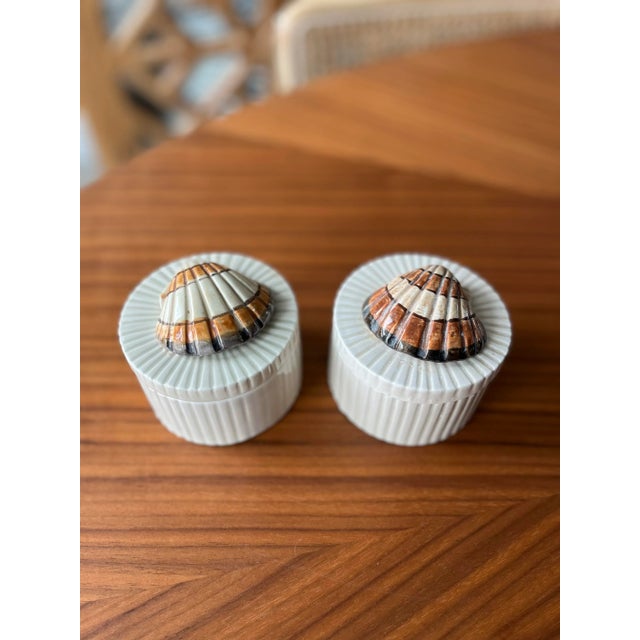 Hand-painted, coastal, canisters perfect hideaway spots for your bath or bedside.