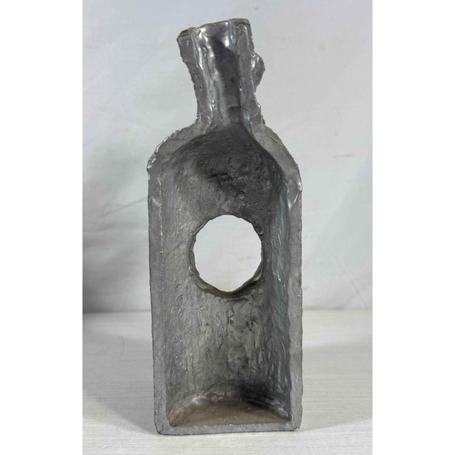 Abstract aluminum sculpture titled "Absolut/Inside Out" by Herbert Simon. Created in 2001. Part of the artist's "Absolut"...