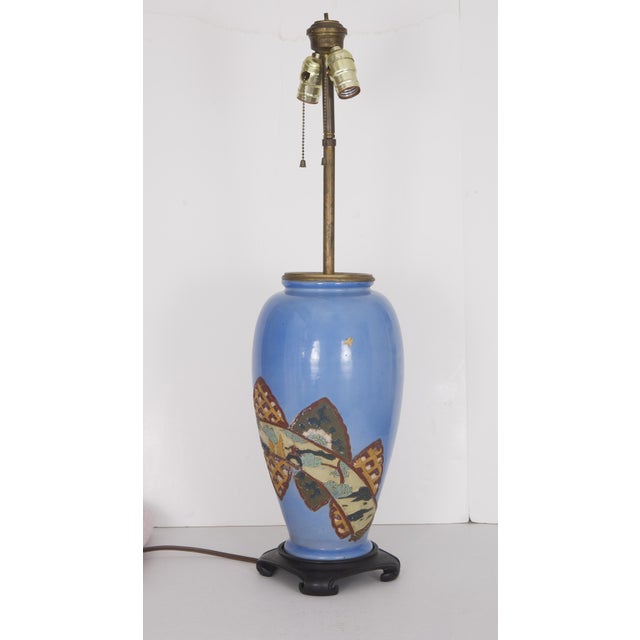 Exceptional 1910s-1930s Asian motif lamp made from an old antique assumed Chinese blue pottery vase with raised relief...