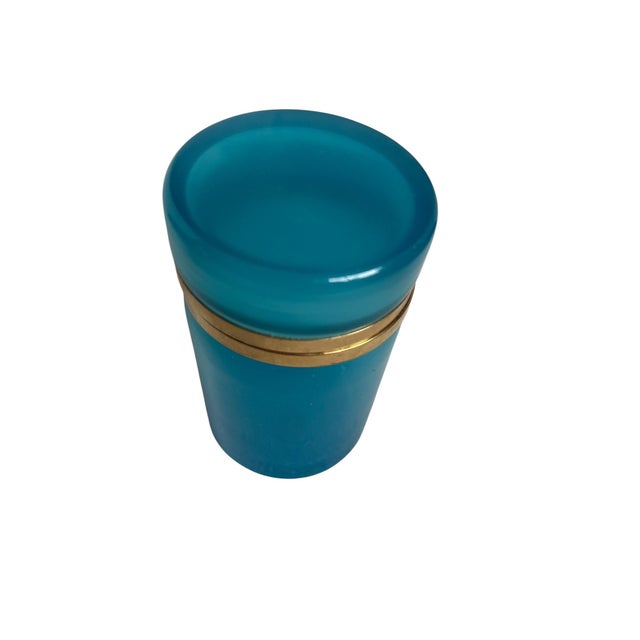 A refined opaline glass box of cylindrical form, crafted in Murano and dating to circa 1860. The piece features a...