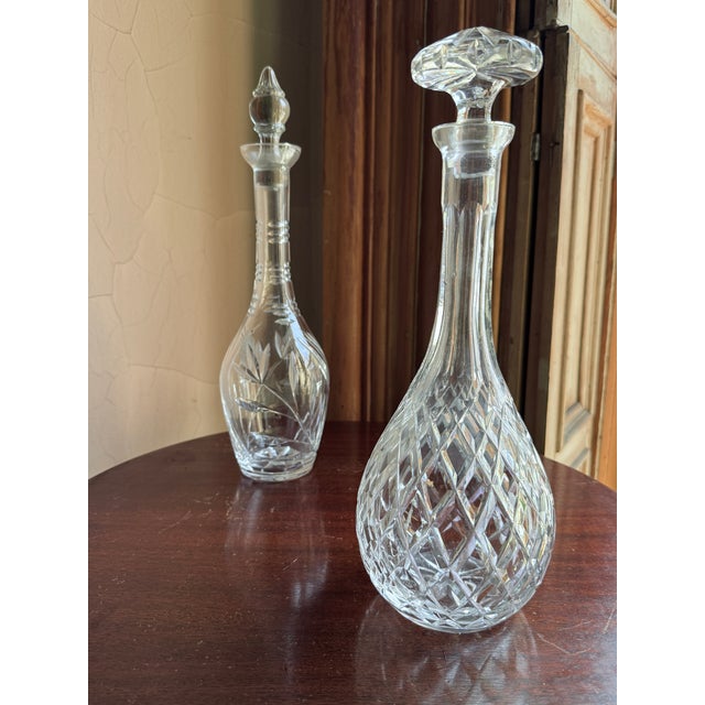 Mid century modern cut crystal decanter, likely dating to the 1950s to 1960s. Elongated teardrop form with flared rim and...