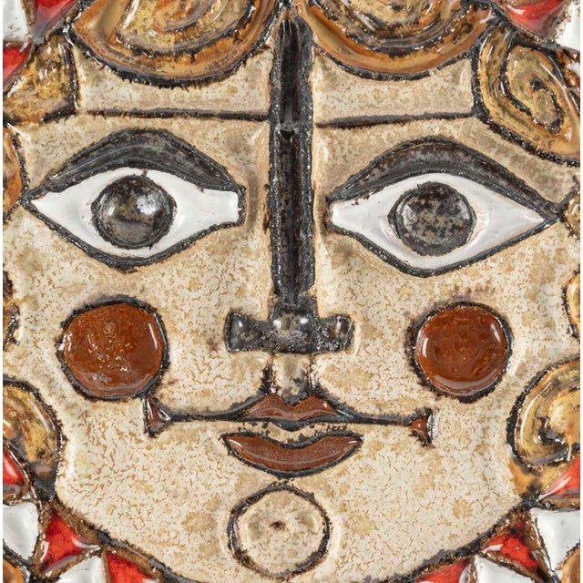 Large terracotta sculpture by Zobel, depicting a sun, in the Cycladic style. Large sun sculpture by Zobel in glazed...