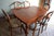 19th-century Dutch mahogany dining table with six chairs. The height of the table is 74 cm. The width of the table is 145...