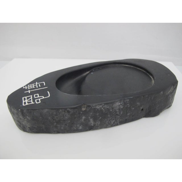 Vintage Japanese calligraphy inkstone (suzuri) used for grinding ink sticks. Features a flat grinding surface that slopes...