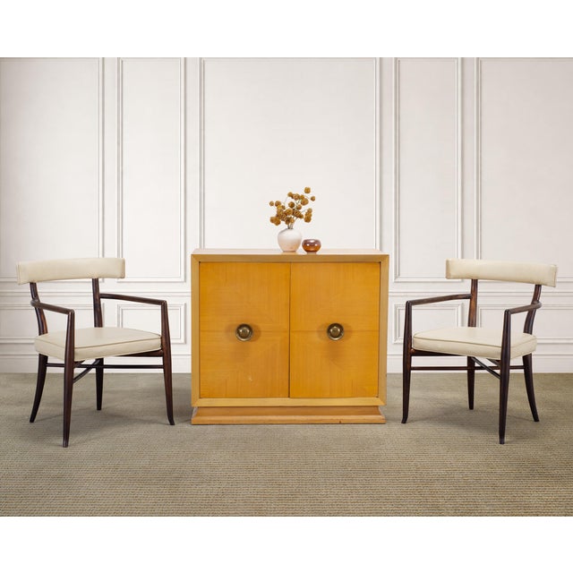 A sculptural set of four exceptionally rare mid-century modern walnut klismos dining armchairs designed by T.H. Robsjohn-...