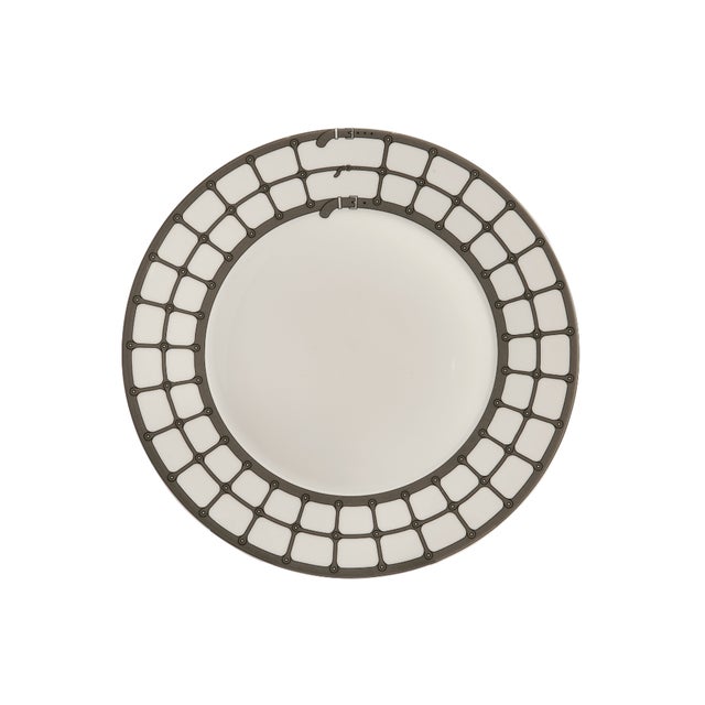 Crafted from fine porcelain, this set of four Aryan Dessert Plates draws inspiration from the tailored detailing of the...