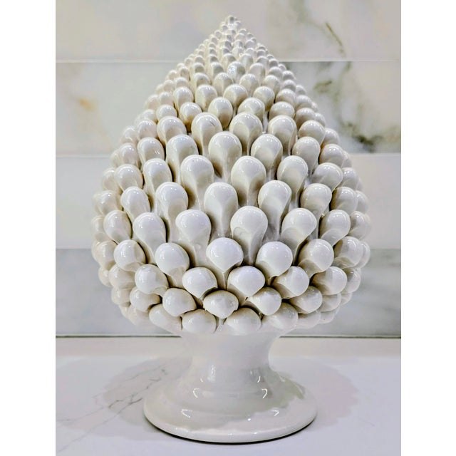 Elevate your tablescape with this striking Italian ceramic pine cone centerpiece, designed by Taitù Milano and produced...