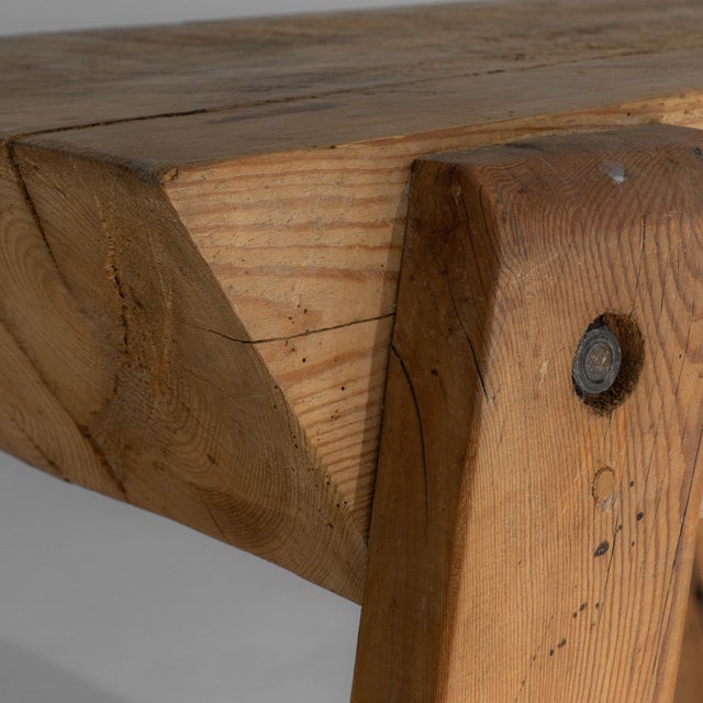 This 20th century French work table embodies honest craftsmanship and utilitarian charm, defined by its solid wood...