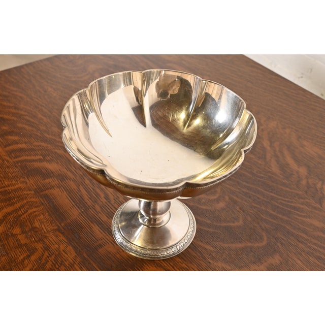 A gorgeous antique silver soldered pedestal fruit bowl or center bowl By Tiffany & Co. (signed to the underside) USA, Late...