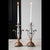 Beautiful pair of late 20th-century two-tone candlesticks featuring a polished silverplate central column set into a warm...