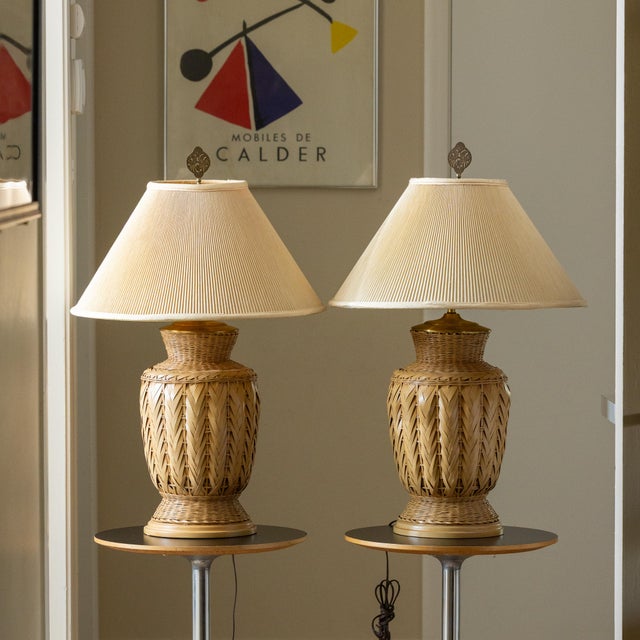 These lamps feature a sophisticated urn-shaped silhouette meticulously crafted with a decorative braided herringbone...