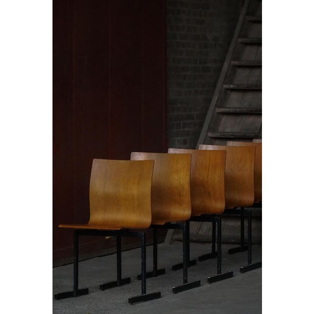 A beautiful set of six industrial stacking chairs designed by Niels Larsen in Denmark, circa 1970s. These chairs exemplify...