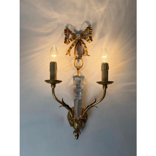 An elegant Italian two-light wall sconce by Banci Firenze, dating to circa the 1970s, combining a richly textured gold...