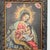 A painting of the Nursing Madonna in the style of the Cuzco School of religious art from Peru in a carved wood frame with...