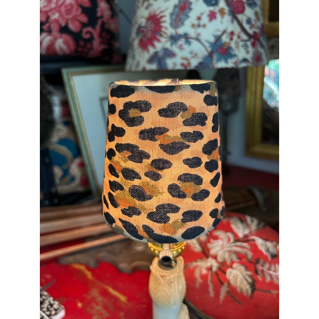 A Leopard print clip top handmade chandelier shade.measurements: top 3” bottom 4” side4”