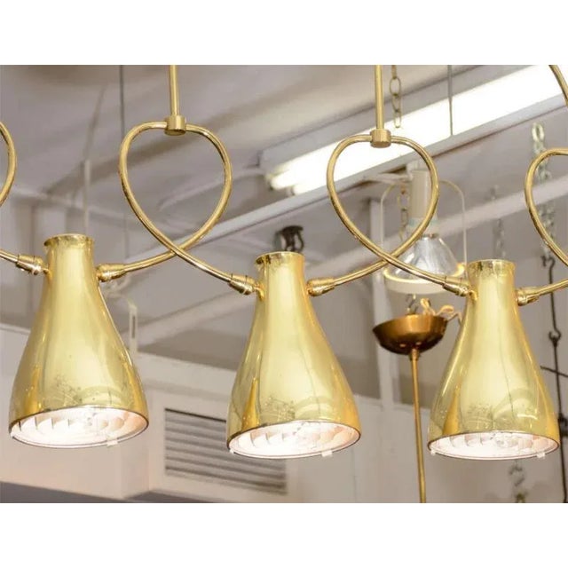 Modernist Five Brass Perforated Design Cone Light Chandelier with Pivoting Mechanisms to turn the Cones to Your Lighting...