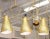 Modernist Five Brass Perforated Design Cone Light Chandelier with Pivoting Mechanisms to turn the Cones to Your Lighting...
