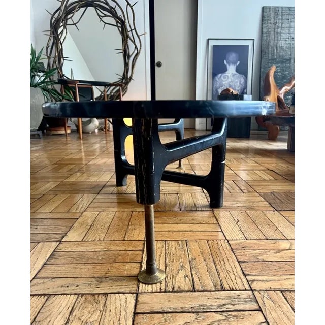 Very rare table with articulated tripod base complimented with a leathered marbled top that is 1” thick. This table is in...