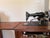 A charming 1930s Singer electric sewing machine, Model 66 features the original solid wood cabinet housing. Thhis model...