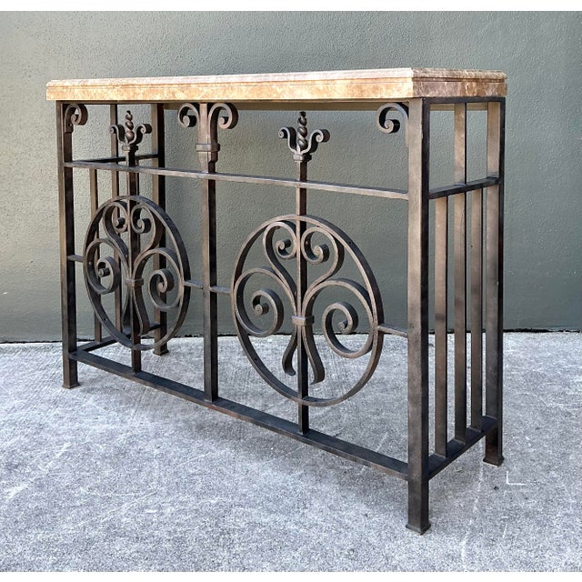 This striking console table is a masterful marriage of architectural salvage influence and sophisticated artisanal...