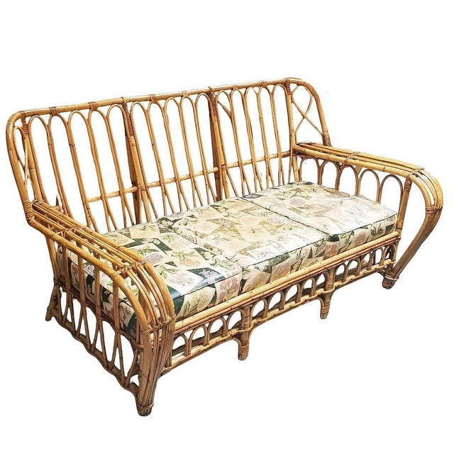 This beautifully restored rare Art Deco stick reed rattan living room with two lounge chairs and a 3-seat sofa. Each seat...