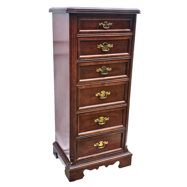 An elegant Chippendale‑style lingerie chest crafted by Bassett Furniture in December 1971, this tall and refined piece...