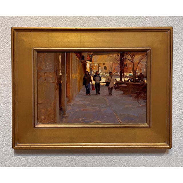 This oil on board painting captures a vibrant moment on a downtown Denver sidewalk, where three figures stroll amidst the...