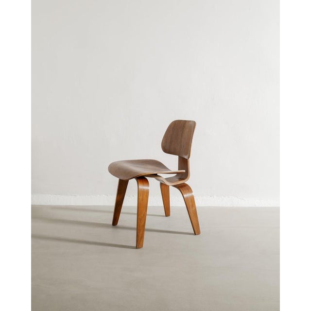 Rare mid century "dcw" wooden easy chair in walnut by charles & ray eames produced by herman miller usa, 1950s in good...