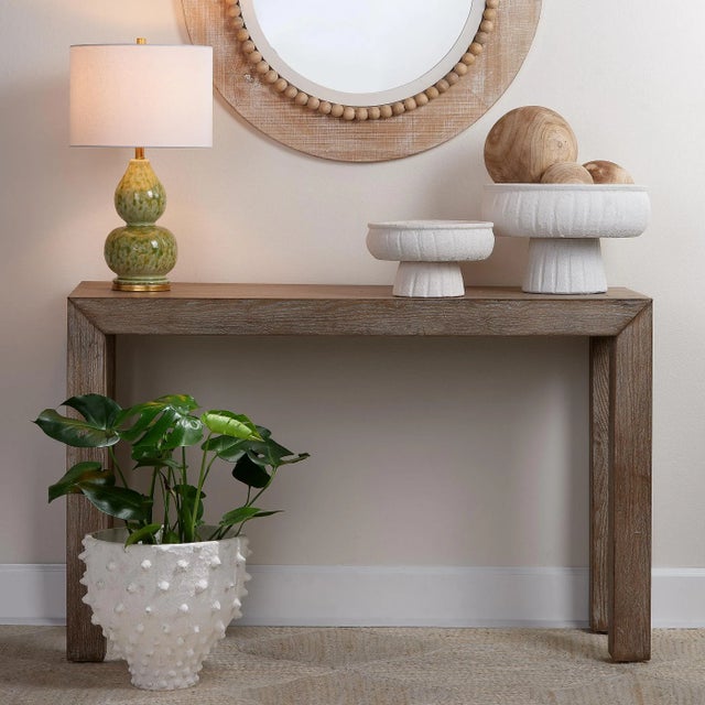 Add an appealing accent to your interiors with this console table. Artisan-crafted, the Parsons silhouette is a modern...