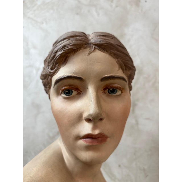 Elegant polychrome plaster bust of a woman, signed Peter Ipsen, the renowned Danish manufacturer celebrated for the...