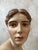 Elegant polychrome plaster bust of a woman, signed Peter Ipsen, the renowned Danish manufacturer celebrated for the...