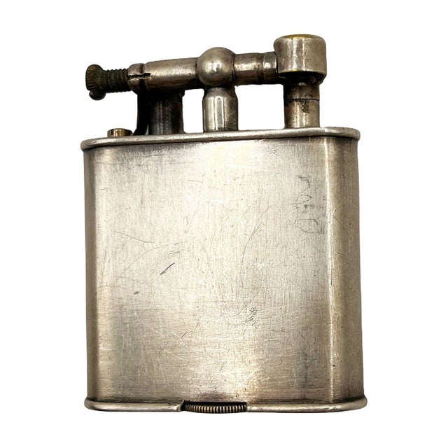 Early Alfred Dunhill “Unique Lighter” Lift-Arm Lighter, c. late 1920s. An exceptional early French Alfred Dunhill “Unique”...
